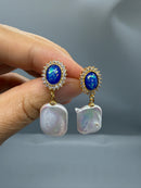 Blue crystal pearl drop earrings close-up showing crystal and freshwater pearl detail