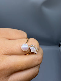 Freshwater pearl ginkgo ring worn on finger, gold plated pearl ring with mother of pearl leaf inlay