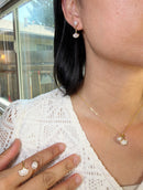 Gold ginkgo leaf pearl jewelry set, necklace earrings and ring worn on model