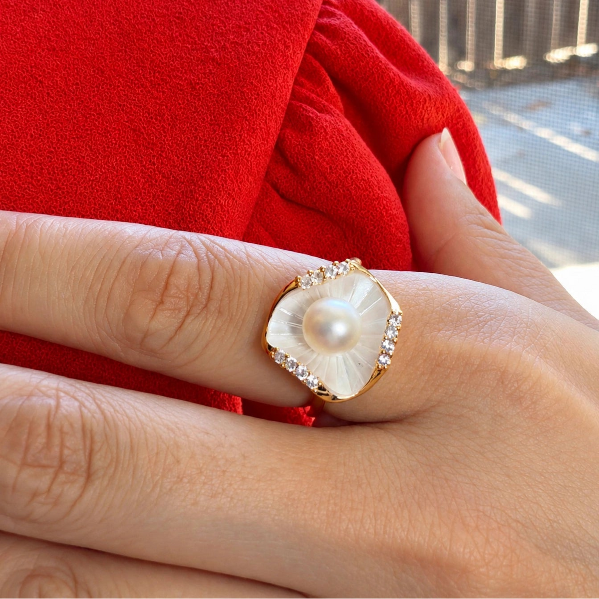 Gold shell pearl ring with mother of pearl worn on model